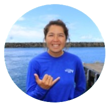a person standing in front of a body of water