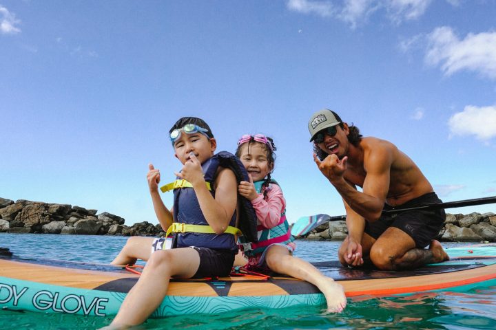 a group of people swimming in a body of water