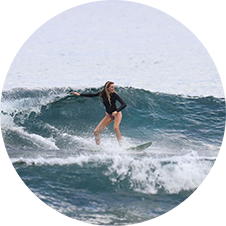 a man riding a wave on a surfboard in the water