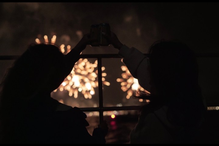 a man sitting in a dark room