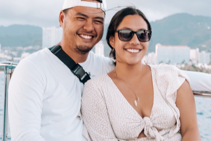 a man and a woman sitting on a bench