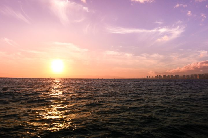 a sunset over a body of water