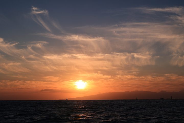 a sunset over a body of water