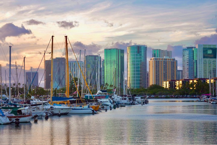 a small boat in a harbor next to a body of water